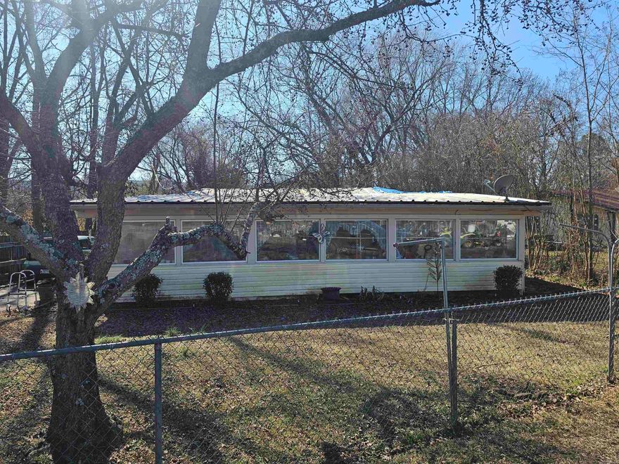 2 bedroom, 1 bathroom house sold as-is. Property has a dock on the back of the property for Harris Brake Lake. There is an inlet from the lake that fills up behind the home per the seller. The property has a storage building, central HVAC and propane wall heaters. Seller installed new walk-in shower unit recently. Property is fully fenced. There is a known roof leak from seller. Property will be cash or in-house bank financing. SELLER IS REQUIRING AGENTS VERIFY PROOF OF FUNDS OR FINANCING PRIOR TO SCHEDULING SHOWINGS. SEE ALL AGENT REMARKS.