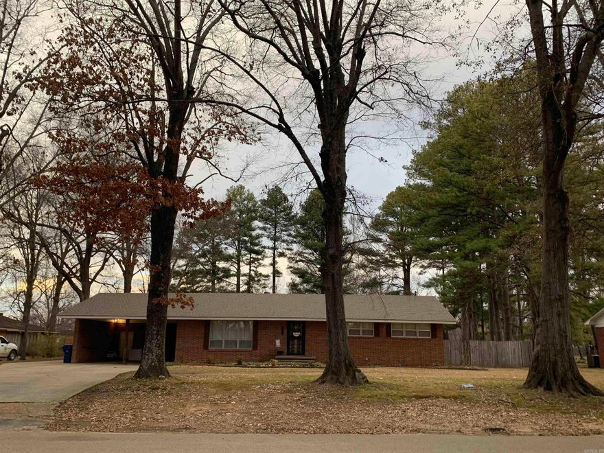 This lovely home features mature shade trees, with a cozy atmosphere throughout with 3 bedrooms, 1.5 baths, large office/workout/sunroom and could also be a 4th bedroom, a huge living room for family and friends entertaining, craft/mud room, spacious laundry room, cedar closet, full bath contains a bathtub and separate walk-in shower, private wood fenced EXTRA large backyard is perfect for kids playing or would be great for storing duck hunting equipment. This home would be a hunters paradise close to food, shopping and within 5 minutes from I-40.  The 2 car carport is a plus and in a good neighborhood close to Brinkley schools, new roof in 2022, HVAC approx. 5 years old.  This home is move in ready!