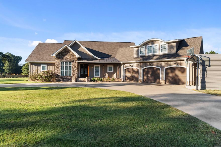 Wow! One-of-a-kind custom-built stunner with beautiful pond views! This exceptional home offers the perfect blend of quality, comfort, and function. The spacious living area features large windows overlooking the water and a stunning stone gas fireplace surrounded by built-ins. The kitchen and open layout make this home ideal for entertaining and everyday living. Upstairs includes a large bonus or game room, perfect for a media space, playroom, or guest retreat. You’ll love the thoughtful extras throughout — including a dog wash station in the laundry room, a 30kW whole-house generator, and a safe room for added peace of mind. The three-car garage includes workshop space, and the circle driveway provides plenty of parking and easy access. Enjoy relaxing on the back patio while taking in the peaceful pond view. Truly a rare property that combines craftsmanship, modern convenience, and serene surroundings!