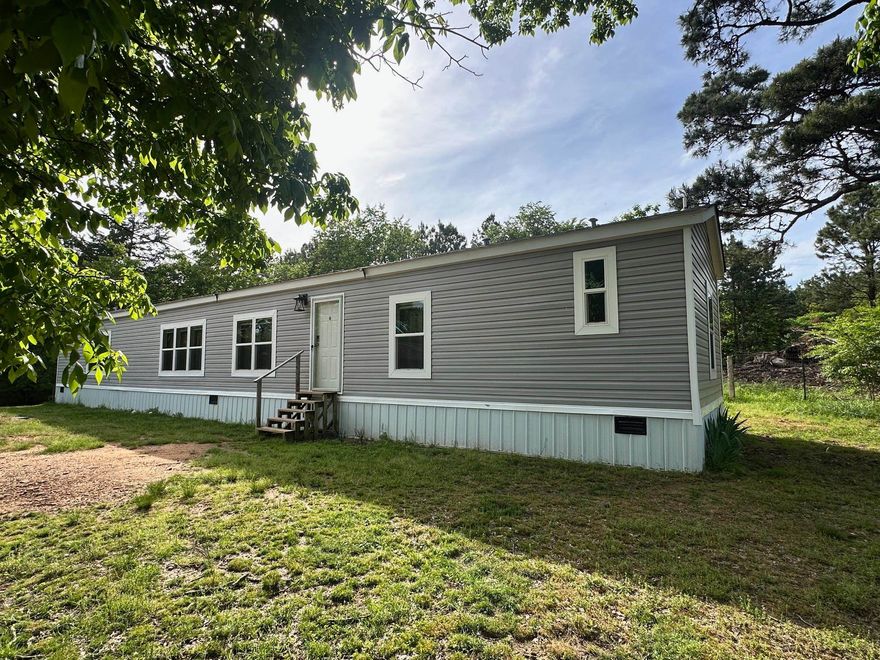 Discover peaceful country living in this beautiful maintained manufactured home situated on 1.28 acres of open space atop Lutherville Mtn!! This modern move-in ready home offers the perfect blend of comfort and convenience, with a spacious layout! This 3 bedroom, 2 bath home has bright and airy interiors, an open-concept kitchen and living area, separate laundry room and large bedrooms. This property is fully fenced with a gated entrance, a 40x30 3 stall metal pole barn, a 10x 8 new metal shed for storage, and a new chicken coop that has a fully fenced area. Whether you're looking for a starter home, downsizing, or a private retreat, this property has it all! Just minutes from town amenities. Call today to schedule your showing!