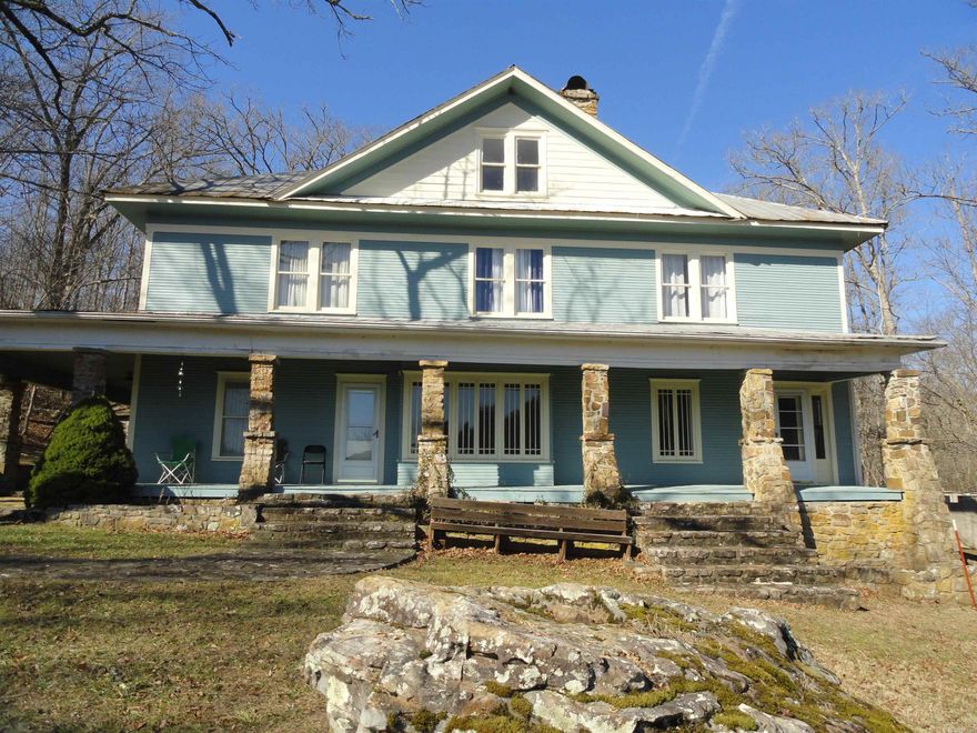 Step into history with this beautifully restored 3,210 sq ft, 3-story former railroad hotel built in 1899, now a viable income-producing opportunity with modern comfort throughout. Featuring 7 bedrooms and 2 baths, this historic gem blends timeless character with central heating & cooling, fiber optic internet, propane backup heat, and a cozy fireplace. Guests will love the breathtaking views of distant mountains and the unbeatable location—just a short walk to the famous Little Red River flowing alongside the old railroad tracks. Also included is a separate 1,620 sq ft caretaker’s residence offering 1 bedroom, 1½ baths—ideal for owner occupancy or additional rental income. Whether you envision a boutique inn, short-term rental, retreat space, or private residence with guest quarters, this one-of-a-kind historic property offers charm, flexibility and strong income potential in a scenic setting on almost 30 acres of mostly wooded land including a spring, pond and an old house that could be renovated.