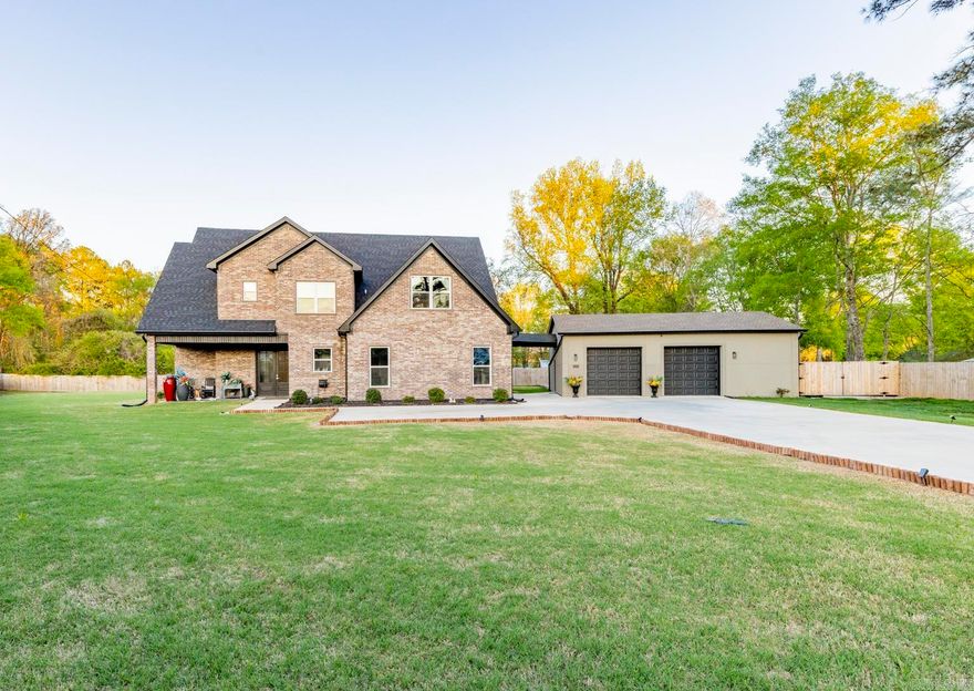 Stunning gated modern home, nestled on approximately 1 acre, conveniently located just seconds away from I-30, offering easy access to nearby amenities. As you enter, you'll be welcomed into a spacious and unique living room featuring a high tray ceiling adorned with a stunning light fixture, creating an inviting atmosphere for relaxation and entertainment. The kitchen boasting quality granite countertops & a double oven, and plenty of cabinets for storage & walk-in pantry. Main level, you'll find the luxurious master suite, providing a private retreat for homeowners. Additionally, there's a man cave/den, perfect for unwinding or entertaining guests, & a convenient laundry room. Upstairs, 3 bedrooms offer comfortable accommodations for family members or guests, each with their own bathroom for added convenience. A bonus room provides additional space for various activities/hobbies. The property also features an extra-large 3-car garage with beautiful cabinets, offering ample storage for vehicles & equipment. Additionally, there's a patio for relaxing, an extra shed within the gated fenced-in yard. This gorgeous home offers perfect blend of luxury, comfort & convenience.