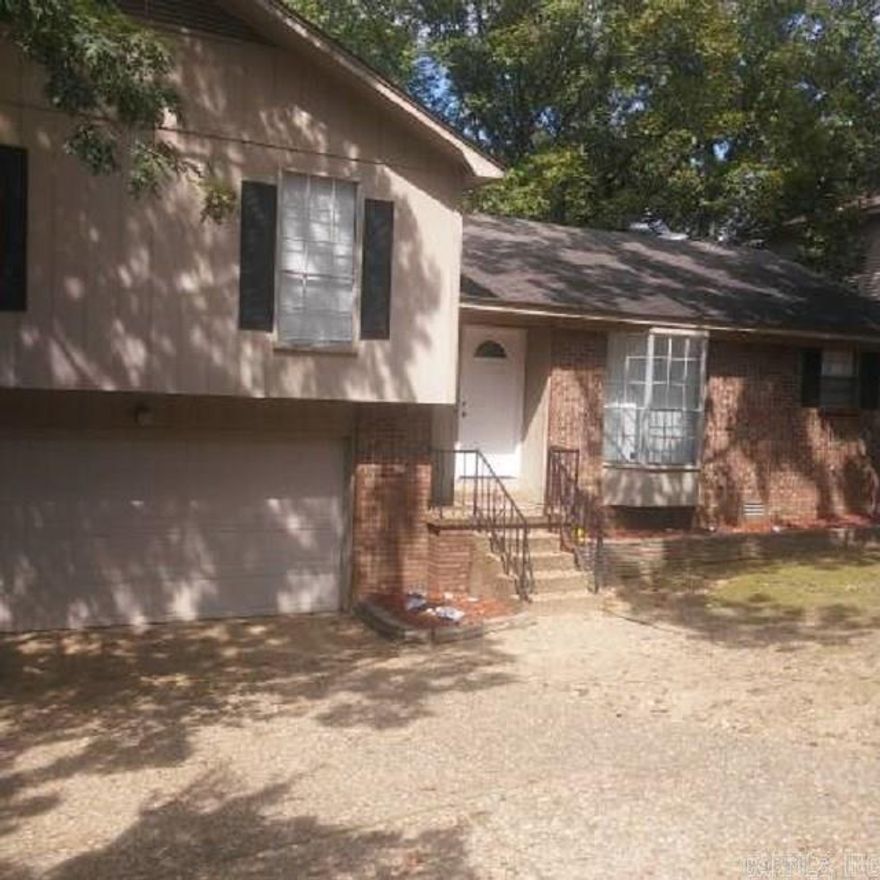 Great 3 bedroom 2 bath home. Main level has kitchen, dining area, living room with brick fireplace. All bedrooms upstairs. Laundry room downstairs. Large deck in back. 2 car garage.