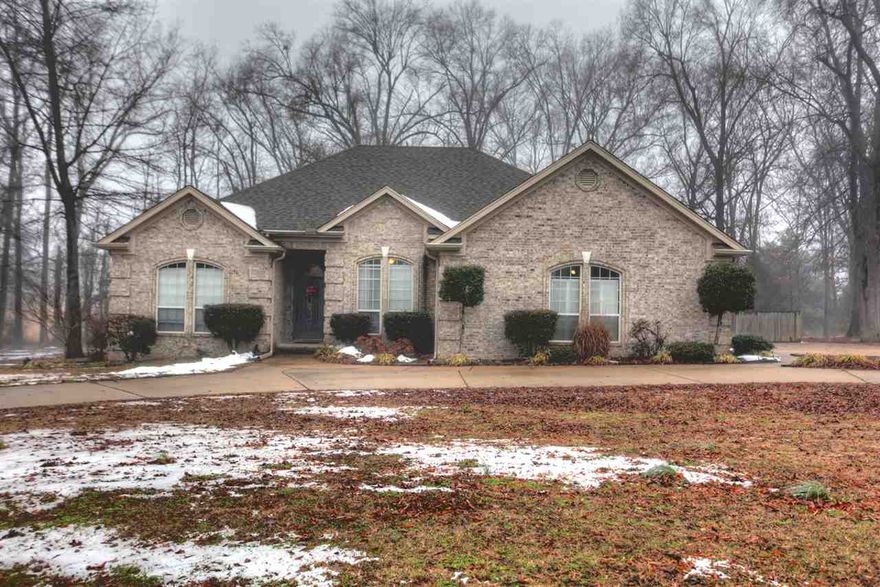 Gorgeous home on 1 acre with 25x30 wired workshop with lean to!  Home offers hardwood, new countertops, bonus room upstairs that's heated and cooled, new airconditioning, jacuzzi, separate shower, all brick, 2 patios, propane fireplace, all electric, tree covered lot, quiet, fluted trim, crown molding, recessed lighting, tall ceilings, pantry, large kitchen, bedrooms split, nice, nice home.