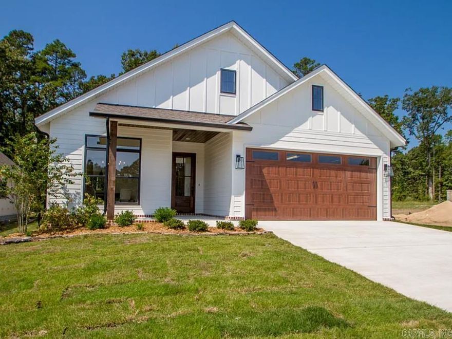 Welcome to Mountain Brook, West Little Rock’s newest and most desirable neighborhood. Conveniently located off Highway 10, just behind The Ranch and the striking Bank OZK campus, this charming craftsman-style home is already underway. Thoughtfully designed, it features an inviting front porch, a breathtaking 12-foot foyer ceiling, cozy fireplace, quartz countertops, and an open-concept layout ideal for both daily living and entertaining.  Exquisite details include custom cabinetry, a functional prep pantry, soaring ceilings, and abundant natural light throughout. The owner’s suite is a private retreat with a spa-like bath offering a soaking tub, oversized walk-in shower, custom closet, and direct access to a spacious laundry room for ultimate convenience.  Mountain Brook is a rare gem—nestled among mature trees, minutes from shopping, dining, and the natural beauty of Pinnacle Mountain and nearby parks. Estimated completion Spring 2026. *Completed home photos are from a previous build of the same floor plan—please inquire with the listing agent regarding finishes and design details of the subject property.