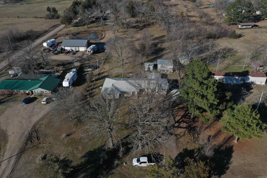 Located just east of Waldron along Highway 80 sits this spacious home on 2 +/- acres. The 2470 Square foot brick home is roomy enough for entertaining family and friends. Boasting Three beds and two baths, along with a spacious living area, large laundry room, and a den/craft room big enough for many uses. A large fenced in back yard contains a two-story work shop, along with a storage building, patio, and gardening area. The front yard is dotted with mature oak trees providing great shade. This home is well built and is ready for its new owner to make it their own. Conveniently located just minutes from Waldron, minutes from national forest, and nearby great fishing opportunities, you’re sure to love all that Scott County has to offer. Don’t miss out on this great Scott County property, call today for your personal tour!