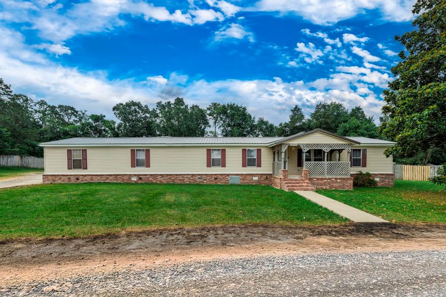 Welcome to this beautifully updated six-bedroom, three-bath home perfectly situated near both Lake Hamilton and Lake Ouachita. Sitting on over an acre of land, this property offers space, comfort, and functionality for any lifestyle. Inside, you’ll find brand new LVP flooring throughout and a stunning kitchen featuring granite countertops and a massive walk-in pantry. The spacious primary suite offers a large bathroom complete with a jetted tub, walk-in shower, and plenty of room to unwind. The living area is centered around a cozy log-burning fireplace, creating the perfect gathering space for family and friends. This home is full of thoughtful updates from top to bottom. Step outside to enjoy the huge fenced-in backyard, perfect for entertaining or letting pets roam. Car enthusiasts and hobbyists will love the oversized, heated and cooled four-car garage, plus there’s a shop in the backyard for even more workspace or storage. With so much to offer and such a prime location near two of the area's most popular lakes, this home truly has it all.