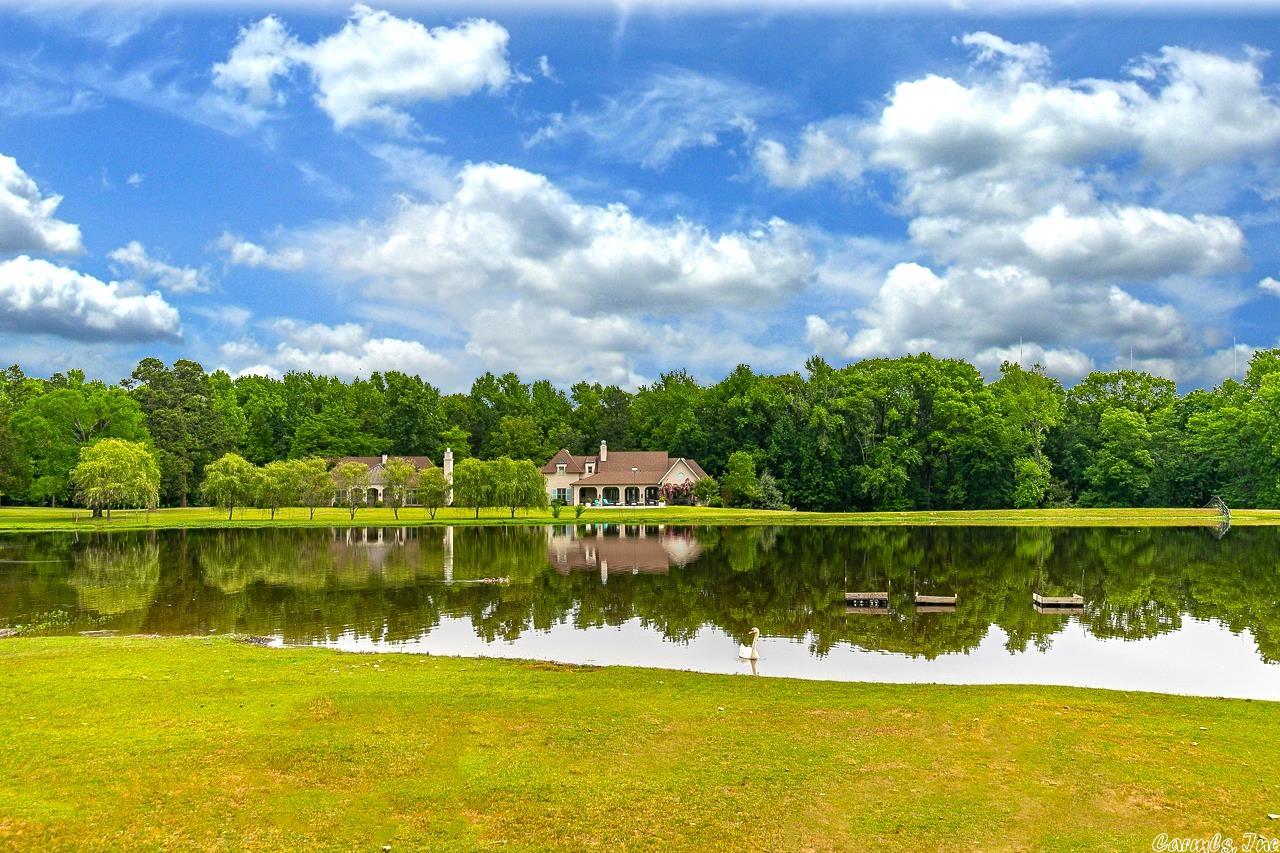 This fabulous property offers a gorgeous main residence with exquisite detail and impeccable quality! Beautiful French Country design combined w/ the perfect floor plan for family living and memorable entertaining. Step inside to experience the ultimate in luxury and southern living. Additional Secondary Home (not included in sf) finely appointed provides lovely guest/in-law or the ultimate home office. One of the most beautiful settings in Pulaski County on approx. 17 acres with barn, stocked lake & more!