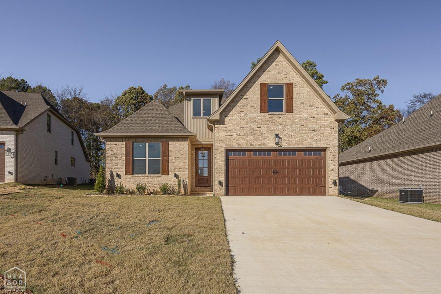 Look what you can find at the end of a tranquil cove within a coveted gated community in the sought-after Hilltop area in Northeast Arkansas. This exceptional home offers a perfect blend of modern elegance and natural serenity. Boasting a generous 2,650 square feet of thoughtfully designed living space. Upon entering, you'll be greeted by a grand open-concept living room illuminated by stunning natural light and contemporary lighting fixtures that seamlessly flow into the modern kitchen. The kitchen is a culinary dream, featuring stone countertops, a gas stove, a pantry, and an inviting island that's perfect for meal preparation and entertaining. A cozy gas fireplace in the living room adds a touch of warmth, making it an inviting space to gather with loved ones. Step outside to discover a large covered back porch that offers a great place for your morning coffee or evening cook-outs with friends, overlooking the privacy of the surrounding woods. Another gas fireplace on the porch ensures that you can enjoy the outdoors year-round, making it an ideal spot for relaxation and outdoor dining. The main level also features a spacious master bedroom with tall tray ceilings, providing an