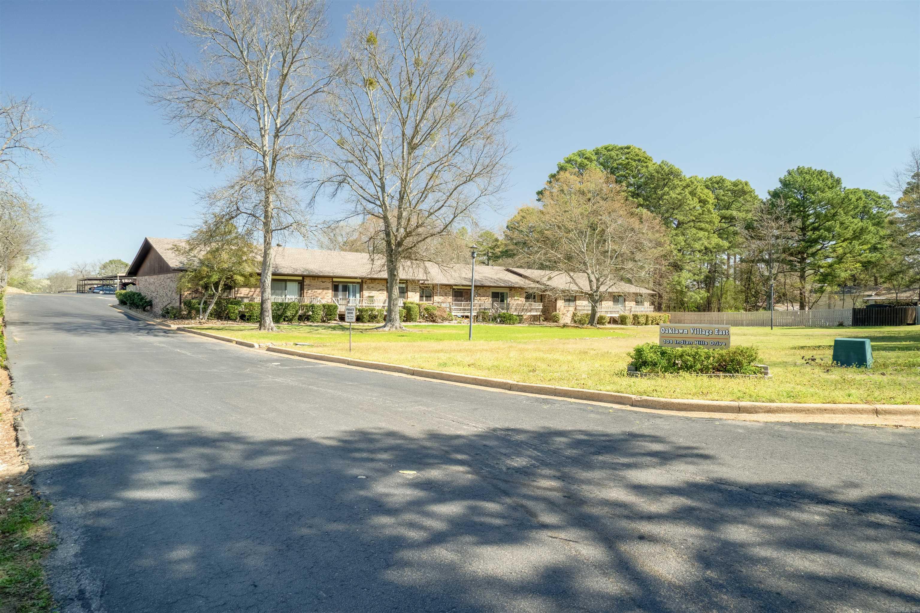 Welcome to this charming one-level, 2-bedroom, 2-bath condo, hardwood floors, and centrally located just minutes from Oaklawn Racing and Casino, shopping, and restaurants. This property is priced to sell and ready for you to add your own "touch" of elegance. You will enjoy the well-groomed grounds, a new roof, and covered parking. Step out your back door to a lovely walking path and appreciate the convenience of this prime location.