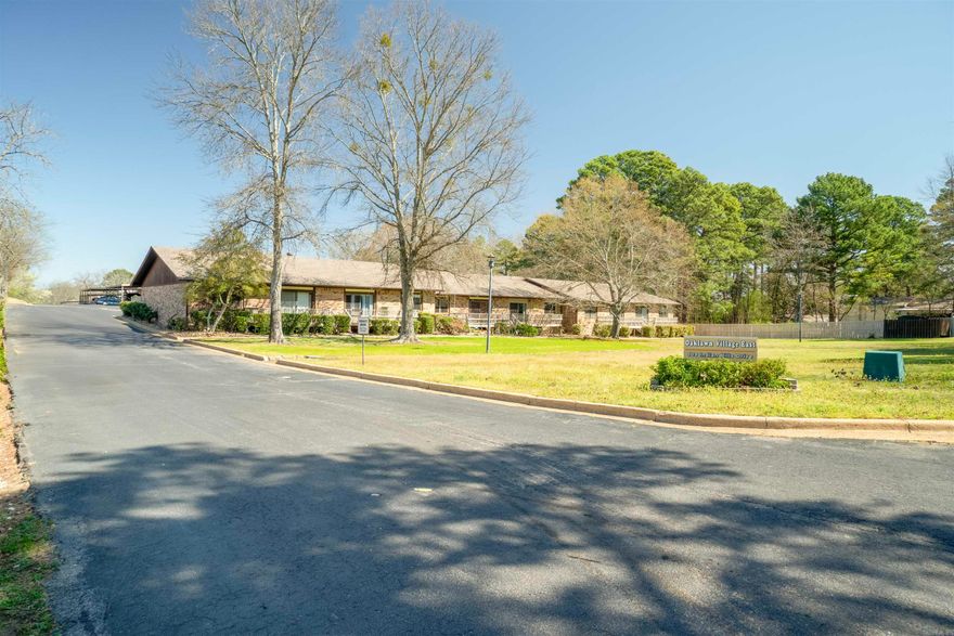 Welcome to this charming one-level, 2-bedroom, 2-bath condo, hardwood floors, and centrally located just minutes from Oaklawn Racing and Casino, shopping, and restaurants. This property is priced to sell and ready for you to add your own "touch" of elegance. You will enjoy the well-groomed grounds, a new roof, and covered parking. Step out your back door to a lovely walking path and appreciate the convenience of this prime location.