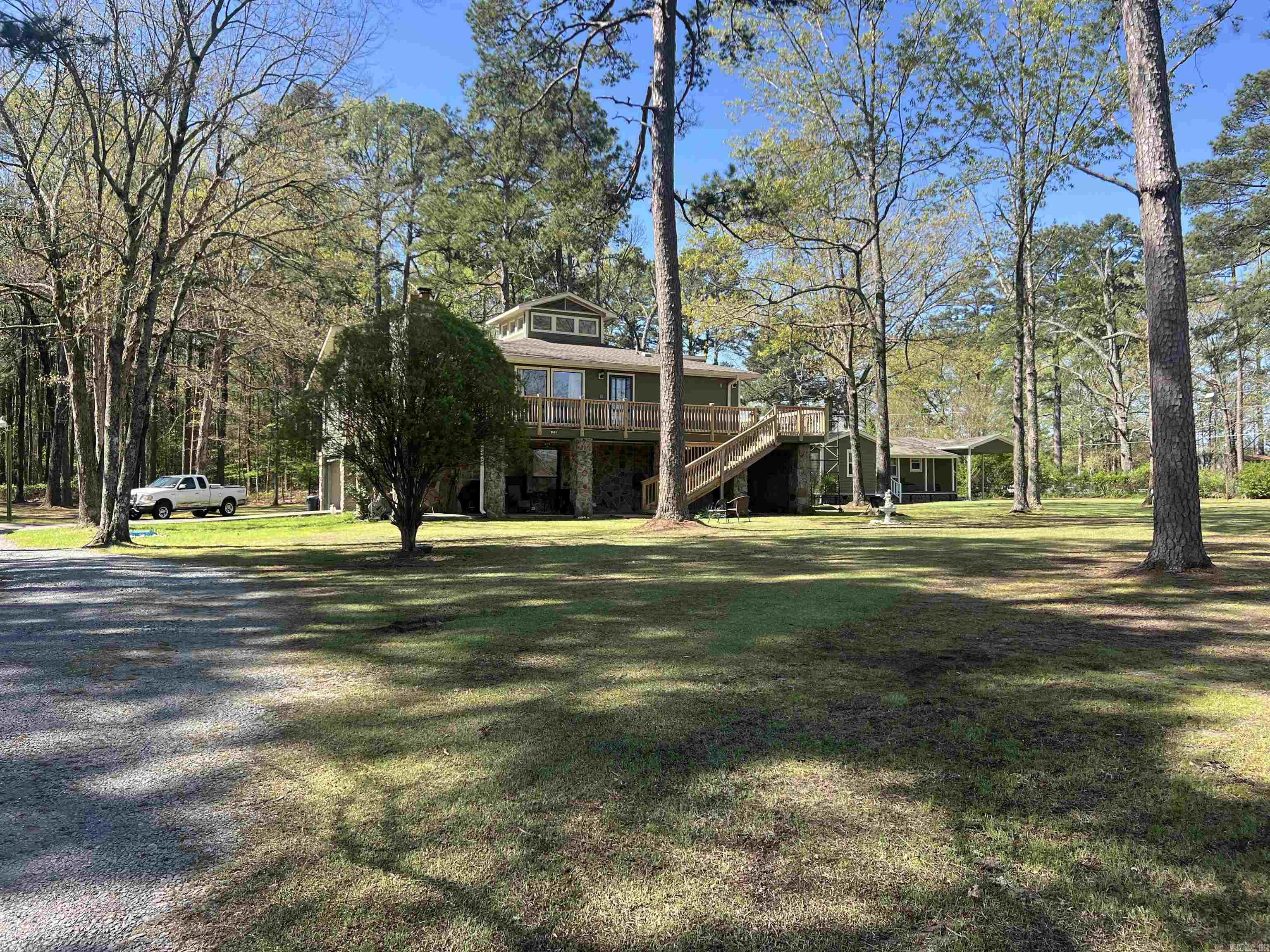Welcome to this beautifully maintained property offering space, versatility, and investment potential. The primary residence is a two-story stone and frame home featuring timeless charm and functionality. Downstairs, enjoy a game room along with a very large laundry room that includes a convenient half bath. Upstairs, you’ll find three generously sized bedrooms and two full bathrooms, providing ample space for family or guests.The heart of the home is the large living room, complete with a cozy wood-burning fireplace. The kitchen is well-appointed, and a newly redone deck wraps around the home, ideal for outdoor gatherings. The home also boasts durable ceramic siding.A standout feature is the expansive workshop with abundant storage perfect for anyone in need of extra space. Included on the property is a meticulously maintained 828 sq ft secondary home, offering two bedrooms and one full bath. Whether you’re looking for a potential rental income opportunity or a comfortable mother-in-law quarters, this home adds incredible value and flexibility and has a separate storage building. There is a bonus parcel, just over an acre in size and all is fully fenced for privacy and security.