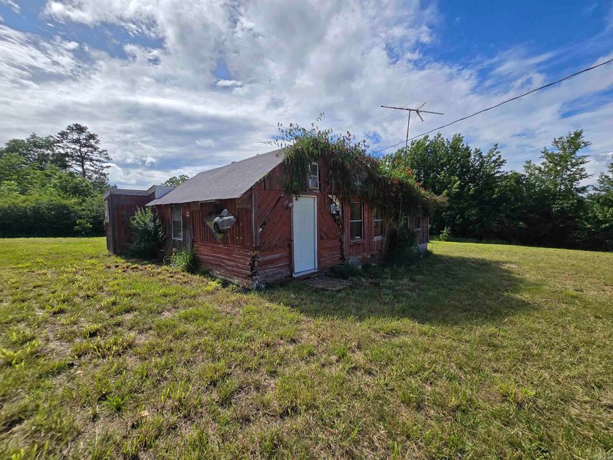 Available again due to no fault of the property. Set on over 18 unrestricted acres, this private property offers peace, space, and possibility. A stunning creek flows through the land, creating a peaceful natural backdrop. The home on site needs major renovation but offers a solid starting point with utilities already in place. With no restrictions, it’s perfect for livestock, new construction, or creating your ideal country retreat.