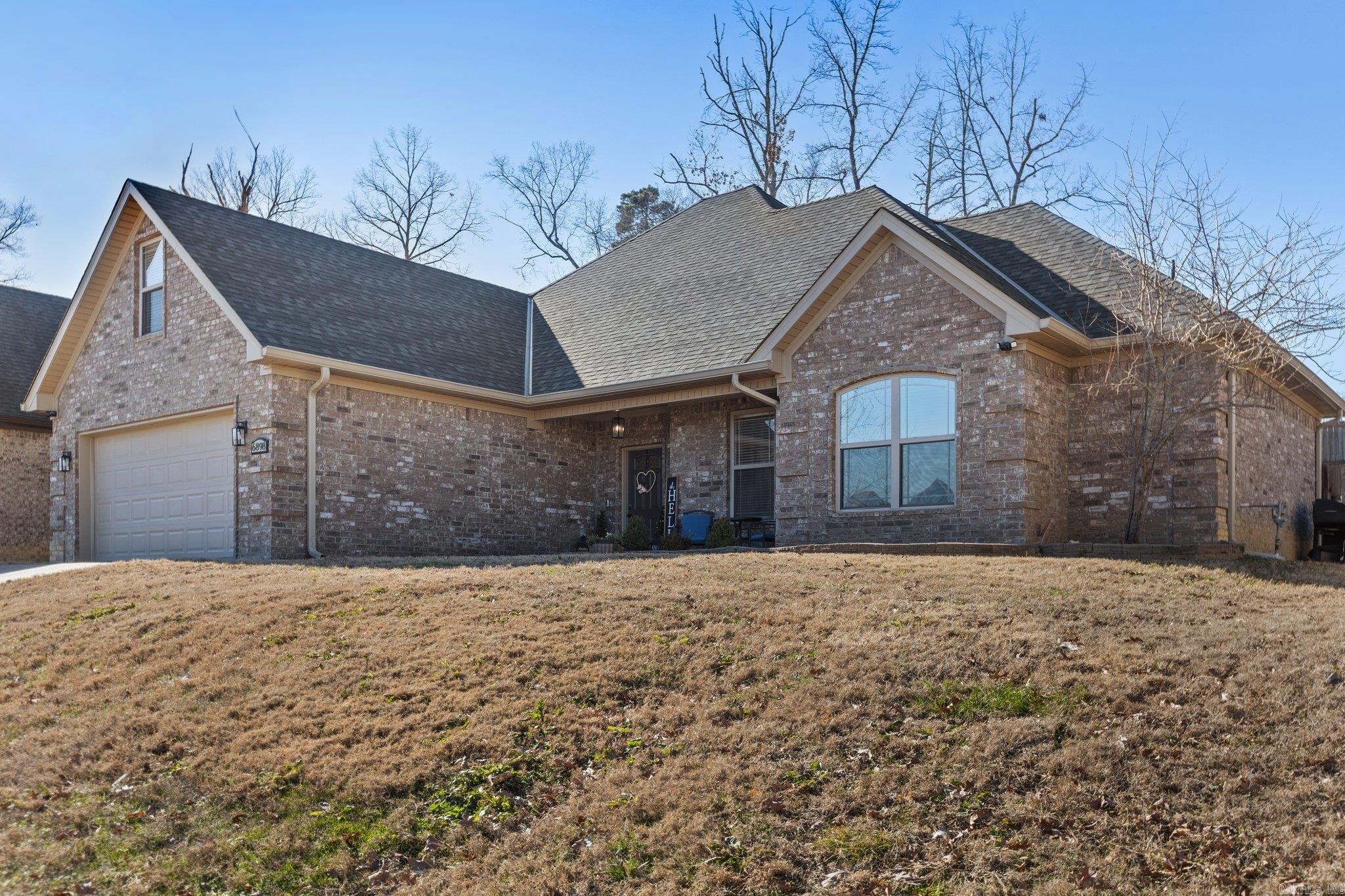 Charming Move-In Ready Home Just Minutes from Little Rock! This beautiful home offers the perfect blend of convenience and comfort, located close to all that Benton and Bryant have to offer. Step inside to find a freshly updated kitchen featuring energy-efficient stainless-steel appliances, a stylish backsplash, and freshly painted cabinets. The entire home has been refreshed with new paint, new carpet, and a brand-new roof, making it truly move-in ready. The layout is both functional and inviting, with four spacious bedrooms on the main level and a large bonus room upstairs. The bonus room offers endless possibilities, itās ideal for a media room, playroom, home office, or workout space. The private ownerās suite is a retreat of its own, boasting a spa-like bathroom with a large walk-in shower, a relaxing soaking tub, and plenty of storage. Enjoy the cozy fireplace in the living room, abundant natural light, and a backyard ready for your personal touch. This home combines modern updates with a thoughtful layout, offering everything you need and more. Donāt miss your chance to see it, schedule your showing today!