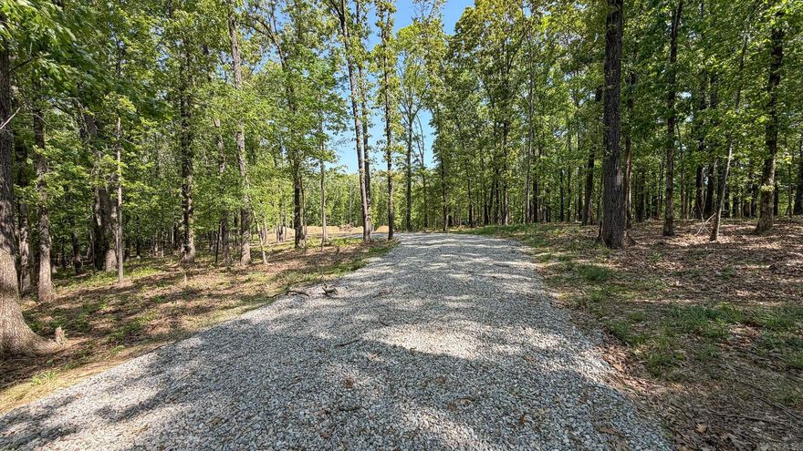Adjacent to RidgePointe Country Club, and accessed by the paved road on Strawfloor Drive, this setting is ideal for a private retreat with stunning sunrise & sunset, a picturesque natural backdrop, and pond view. The most unique setting combining easy access to the city of Jonesboro with the seclusion of a rural setting. Perfectly suited for a visionary homeowner or investor looking to capitalize on one of Jonesboro's most coveted area. This property is all ready & thoughtfully prepared with a cleared homesite and in place, along with a ready to make pond and charming chat driveway. House plans are ready & available to you. Offering both privacy and natural beauty, this is the perfect setting for your custom estate.