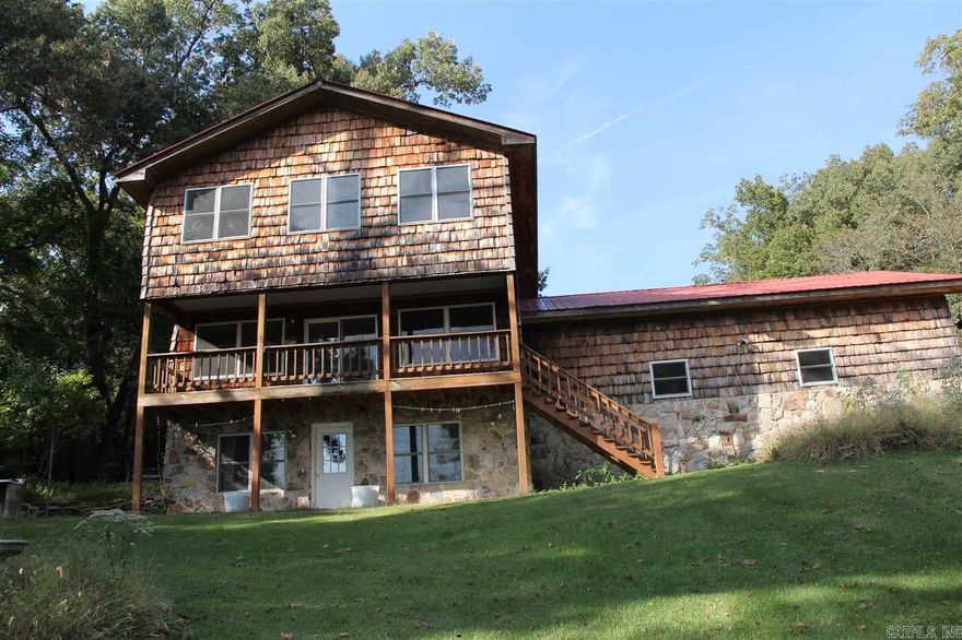 Lakeview, Lakeview, Lakeview on Norfork in Gamaliel, This 6 possibly 7 bedroom home, with 3 baths, and 2 garages for a total of 4 cars is great for a large family or a vacation getaway.  Have your boat on the lake within 10 minutes and be fishing. The view from the deck is absolutely stunning and peaceful.