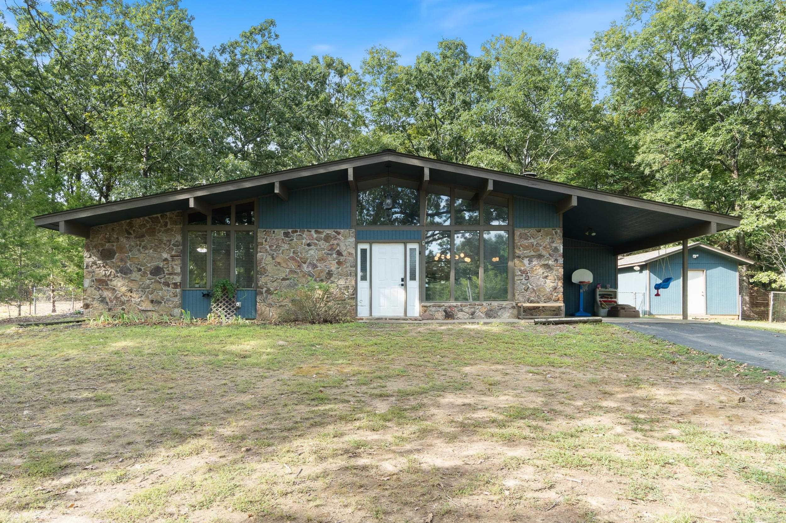 Welcome to this charming and newly updated 2-bedroom, 1-bath home on over an acre just outside Conway city limits! Step inside to a warm and inviting living space featuring vaulted ceilings with exposed beams, a stone accent wall, and hardwood floors that add timeless character. The remodeled kitchen shines with new tile, stylish appliances, granite countertops, and a modern sink. The bathroom has also been beautifully updated with a new tub and tiled shower combo, granite vanity, and new toilet. Fresh interior paint throughout gives the home a bright, move-in ready feel. Enjoy extra living space in the bonus room/sunroom, now complete with added heating and cooling, perfect for year-round use. Outside, youāll find plenty of room to relax or entertain with lots of trees and a 14x20 workshop for projects or storage. This home is truly one of a kind!