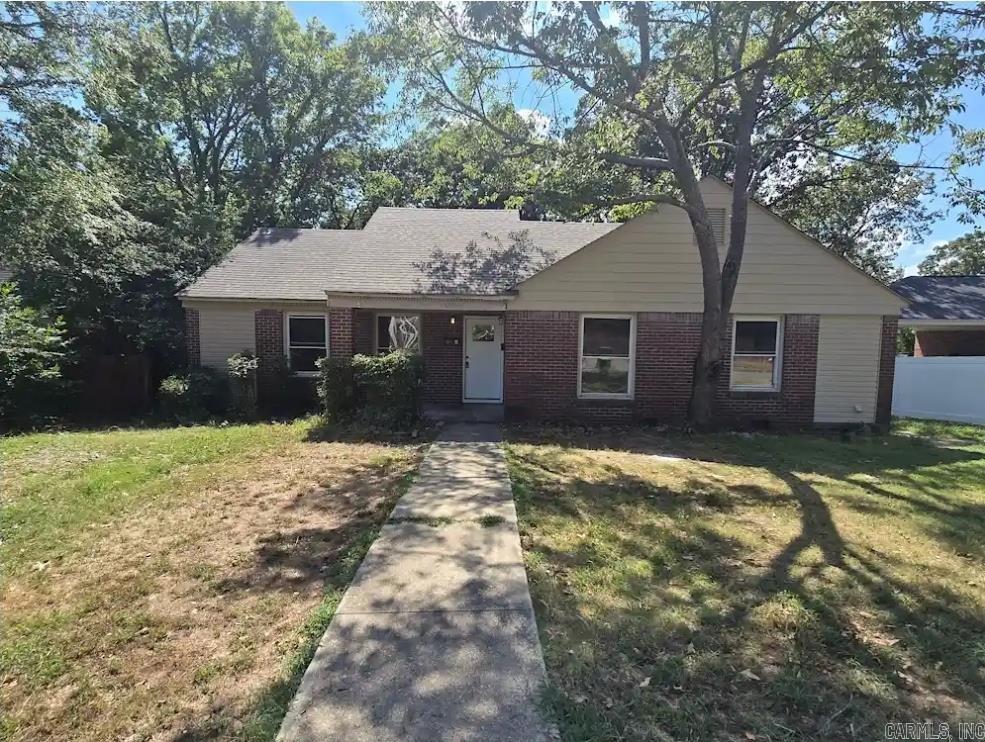 Step into this inviting 2-bedroom, 1-bath duplex that blends comfort and charm. Beautiful warm-toned wood grain floors flow throughout the living space, creating a cozy and welcoming atmosphere. The quaint kitchen offers just the right touch of character, with everything you need for everyday living and simple entertaining.