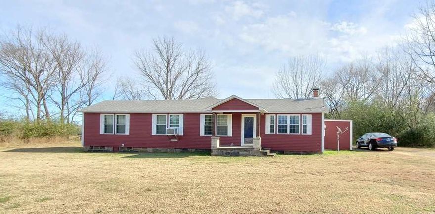 Adorable country bungalow type home or on level 2.55 acres with no restrictions. Has original tongue and groove ceilings and walls. Large main room, 3 bedrooms, separate dining room and bonus room that could be another room or sunroom. Bathroom has been updated and is handicapped accessible.  Newer windows, roof and red metal siding. Great starter home or investment property!!