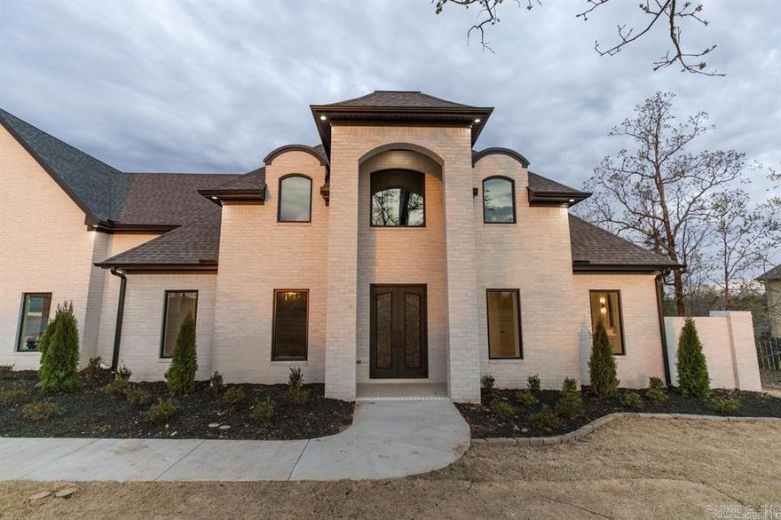 Discover a luxurious retreat that perfectly balances privacy, sophistication and a vibrant community lifestyle in Waterview Estates. This stunning 5BR/4.5BA home sits on just over a half-acre, offering serene mountain view over lake Maumelle and direct access to the neighborhood's premier amenities. Enjoy the breathtaking views of sunsets from your deck overlooking your beautifully landscaped backyard.  Backyard backs up to greenspace and is fully fenced. Open concept living spaces designed for entertaining and family fun! Gourmet kitchen with high-end appliances, expansive island and hidden walk-in pantry! Primary suite features a spa-live bath, double vanity and well oversized closet. Bonus spaces that adapt to your needs: media room, home gym or quiet study. Luxury finishes throughout.  This one is a must see! Open Sunday 2/22 from 2-5:30pm to view the beautiful sunset.  Agents please check "Showing Remarks".