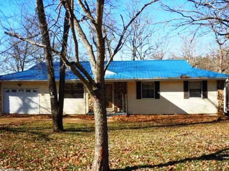 3 BD, 2 BA HOME ON CROWN LAKE w/approx. 238' of Lake Frontage. Gas log F/P in DR to heat entire house. Convenient kitchen w/eating area + breakfast bar. 6x7 Laundry area off kit w/door to one car garage w/auto opener. Includes stove, newer Refrig w/large freezer on bottom, D/W, Microwave & W/D. 7x32 sun rm off kit & Mstr BD overlooking lake w/18x17 deck. 12x18 Mstr BD w/Mstr BA that has walk-in shower. Sprinkler system from lake, dock w/cement pad in back for picnic table, etc., chain link fenced backyard.