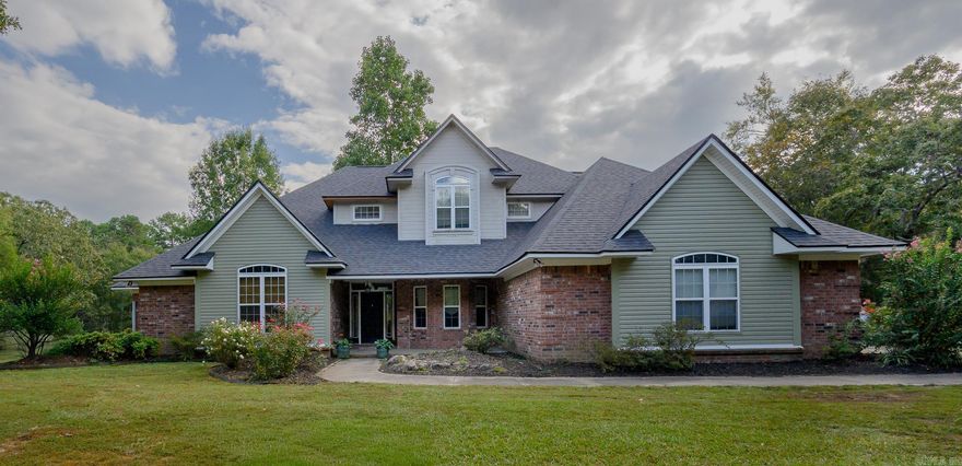BEAUTIFUL home brimming with features and ideally located in the Mena Lake area!   The home includes vaulted ceilings in the living room, open concept kitchen (complete with attractive cabinetry granite countertops, and stainless steel appliances), a lovely breakfast nook overlooking the fenced deck and POOL, & 2nd seating area with a gas fireplace!   Primary suite is located on the 1st floor, including a walk in closet, double sinks in the bathroom, separate shower and jacuzzi tub!   The 1st floor also includes a formal dining and separate office.   The lofted 2nd floor has 3 spacious bedrooms, (two with a connecting Jack and Jill bathroom) and the other with its own en suite bathroom and built in desk & storage!   There is ample additional storage throughout the home, large pantry, and a laundry room with a sink, countertops and storage cabinetry!   Appliances new in the past 2 years including water heaters and AC units! New luxury vinyl on the main floor, & Brand New exterior siding and roof!   Complete with 2 car garage, additional 1 car garage that could be used as a shop AND a FEMA approved storm shelter!  All this sits on over 2 acres! A private oasis just minutes from town!