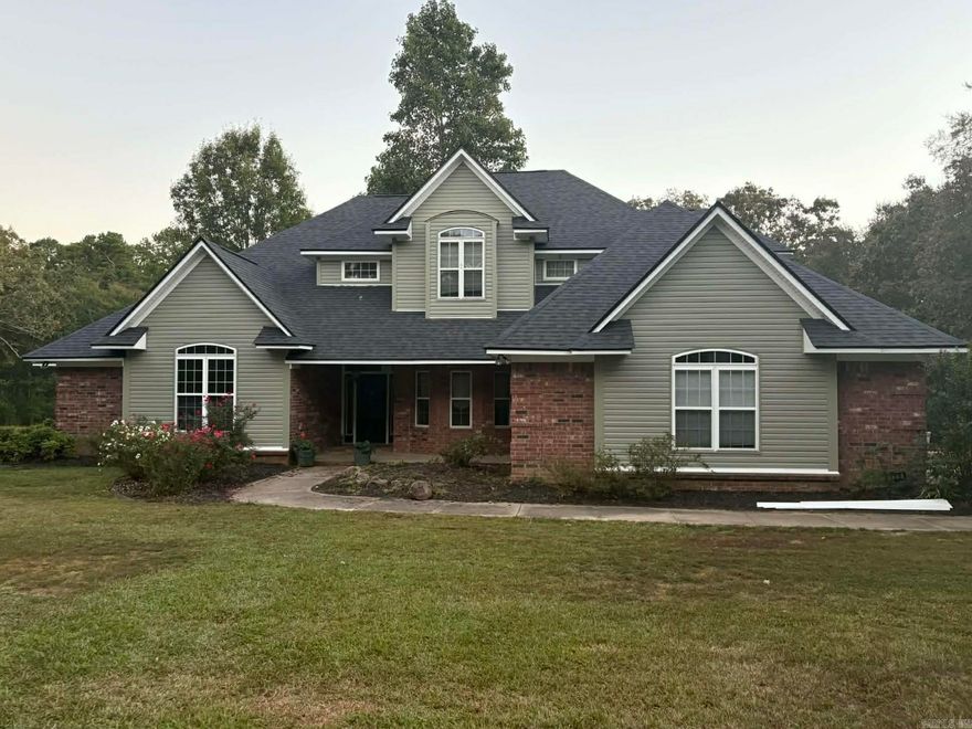 BEAUTIFUL home brimming with features and ideally located in the Mena Lake area!   The home includes vaulted ceilings in the living room, open concept kitchen (complete with attractive cabinetry granite countertops, and stainless steel appliances), a lovely breakfast nook overlooking the fenced deck and POOL, & 2nd seating area with a gas fireplace!   Primary suite is located on the 1st floor, including a walk in closet, double sinks in the bathroom, separate shower and jacuzzi tub!   The 1st floor also includes a formal dining and separate office.   The lofted 2nd floor has 3 spacious bedrooms, (two with a connecting Jack and Jill bathroom) and the other with its own en suite bathroom and built in desk & storage!   There is ample additional storage throughout the home, large pantry, and a laundry room with a sink, countertops and storage cabinetry!   Appliances new in the past 2 years including water heaters and AC units! New luxury vinyl on the main floor, & Brand New exterior siding and roof!   Complete with 2 car garage, additional 1 car garage that could be used as a shop AND a FEMA approved storm shelter!  All this sits on over 2 acres! A private oasis just minutes from town!