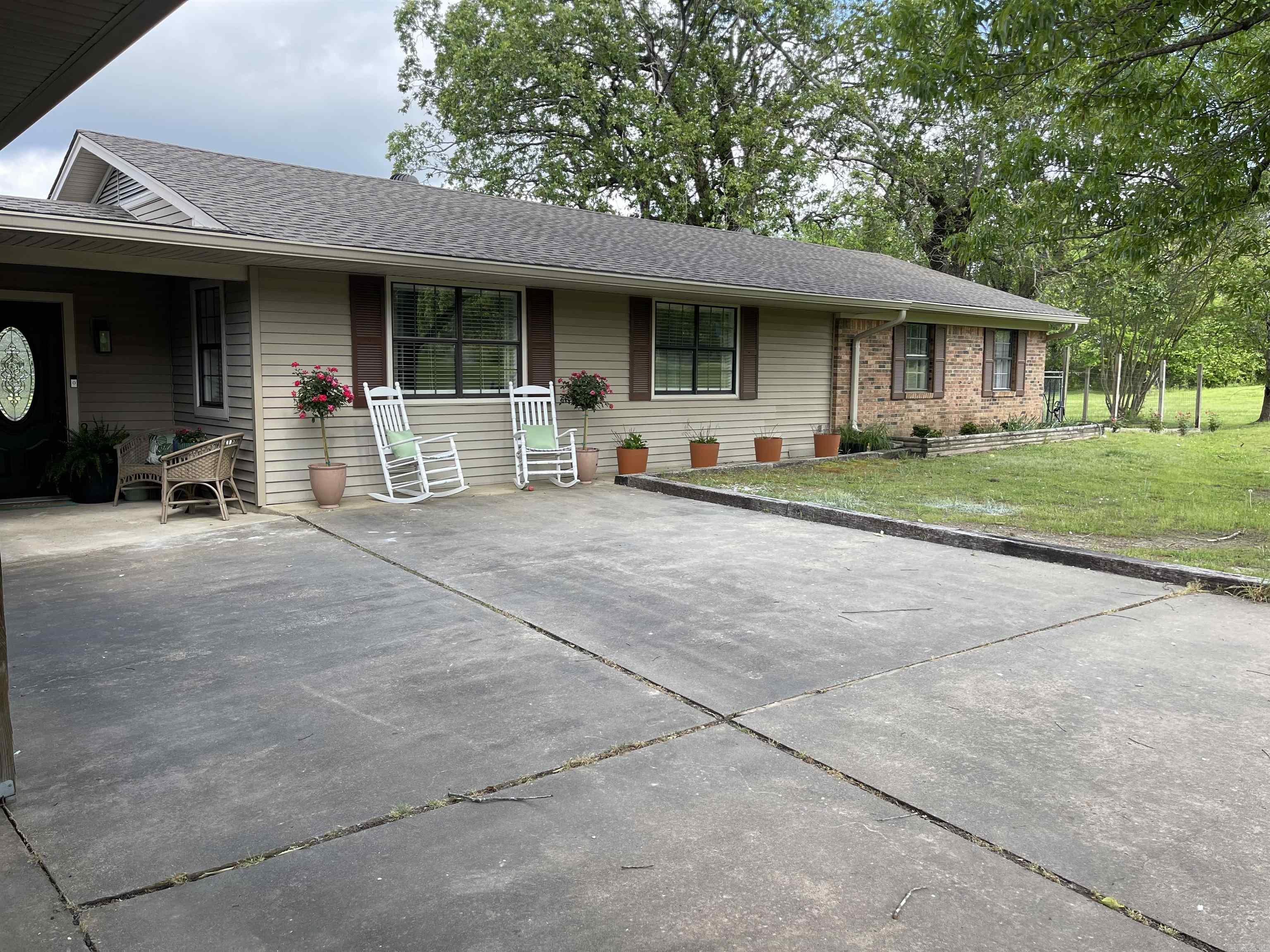 MOTIVATED SELLERS! Welcome to this stunning, fully remodeled 4-bedroom, 3.5-bath country home in Benton AR, nestled on 3.9 acres of peaceful land. With 2,899 Sqft of beautifully updated living space, this home offers comfort and style, featuring a spacious bonus room for added flexibility. The open concept layout is perfect for family gatherings and entertaining. Step outside to enjoy a sparkling pool, open pasture and a storm shelter for peace of mind. A barn with two horse stalls adds to the charm. Additional perks include fully paid-off solar panels! Meaning the utility costs on this home are almost nonexistent. Whether you're looking for room to grow or a tranquil retreat, this property has it all! Additional acreage is available for purchase with the home.