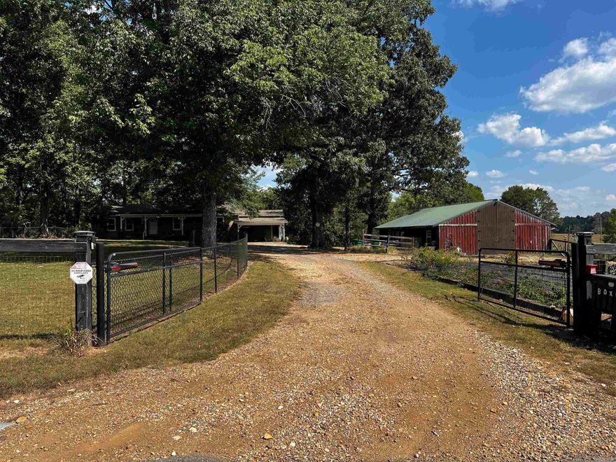 Beautiful Homestead 1-Story Home, 5-acres, Horse Barn, Greenhouse, Gardens, Pastures, Fenced/ Cross Fenced, Pond - Everything you need. Wood Floors throughout with Tile Bathrooms. Updated Kitchen. Lenox Heat/Air. Wood Stove Heat in Living Area. Public Water. Secluded near the end of the road. Two Security Gates with Elec Closers. Above Ground Pool. Hot Tub. Deck overlooks pastures. Beautiful Homeplace for your farm and family to enjoy. Just minutes & easy access to City of Little Rock. Park your RV in the Barn with RV Elec Hookups. Horse Barn can have 4 stalls. Not in the City Limits.