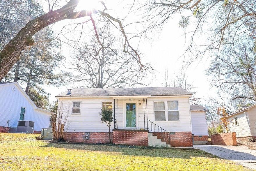 Fall in love with this charming 2 bed/1 bath cottage full of cozy vibes and modern updates.  1396sq ft of beautiful hardwood floors, new carpet, built ins and an updated kitchen.  There is an extra room perfect for a second living space, office or guest bedroom.  This home has a huge backyard and relaxing covered porch.  Updates were completed 2-3 years ago.  All appliances to convey. Conventional financing or cash buyer's welcome! Move in Ready!