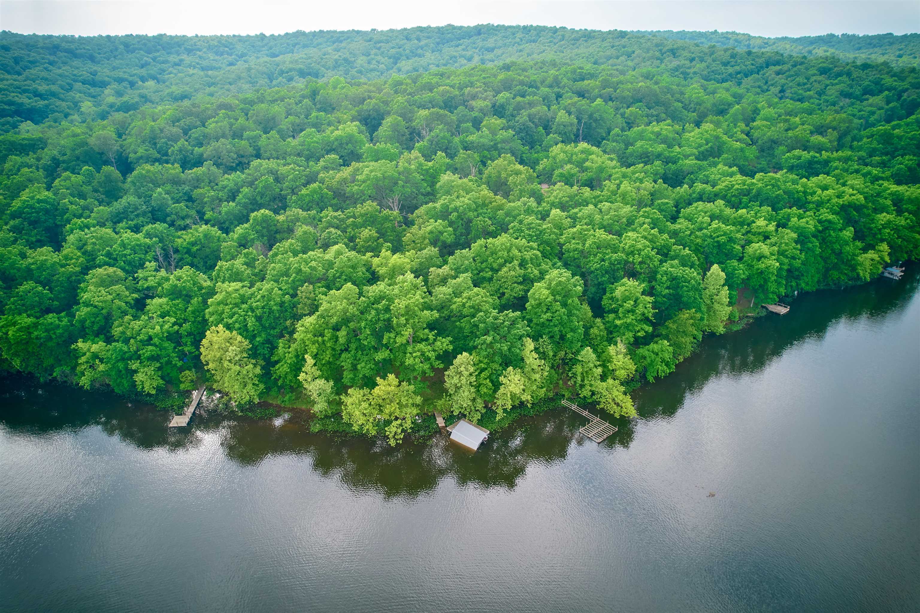 OZARK MOUNTAIN LAKE FRONT -APROX 2 AC+/- WOODED LAKEFRONT RESIDENTIAL BUILDING PROPERTY ON PRIVATE LAKE SHERWOOD! A rare tract ready to build your mountain lake vacation cabin or retirement home. This property offers about 500 ft of easy lake shore and more than one good building sites. There are two docks, one has a boat slip. There is a mountain & lake vista. Lake Sherwood is a 110 ac recreation & spring feed lake. Enjoy skiing, tubing, swimming & fishing at it's best. Spring River for canoeing, rafting & trout fishing is less than a mile away. Hardy city water services this property. Paved roads are another feature for this lakefront tract. This waterfront property is a must see!