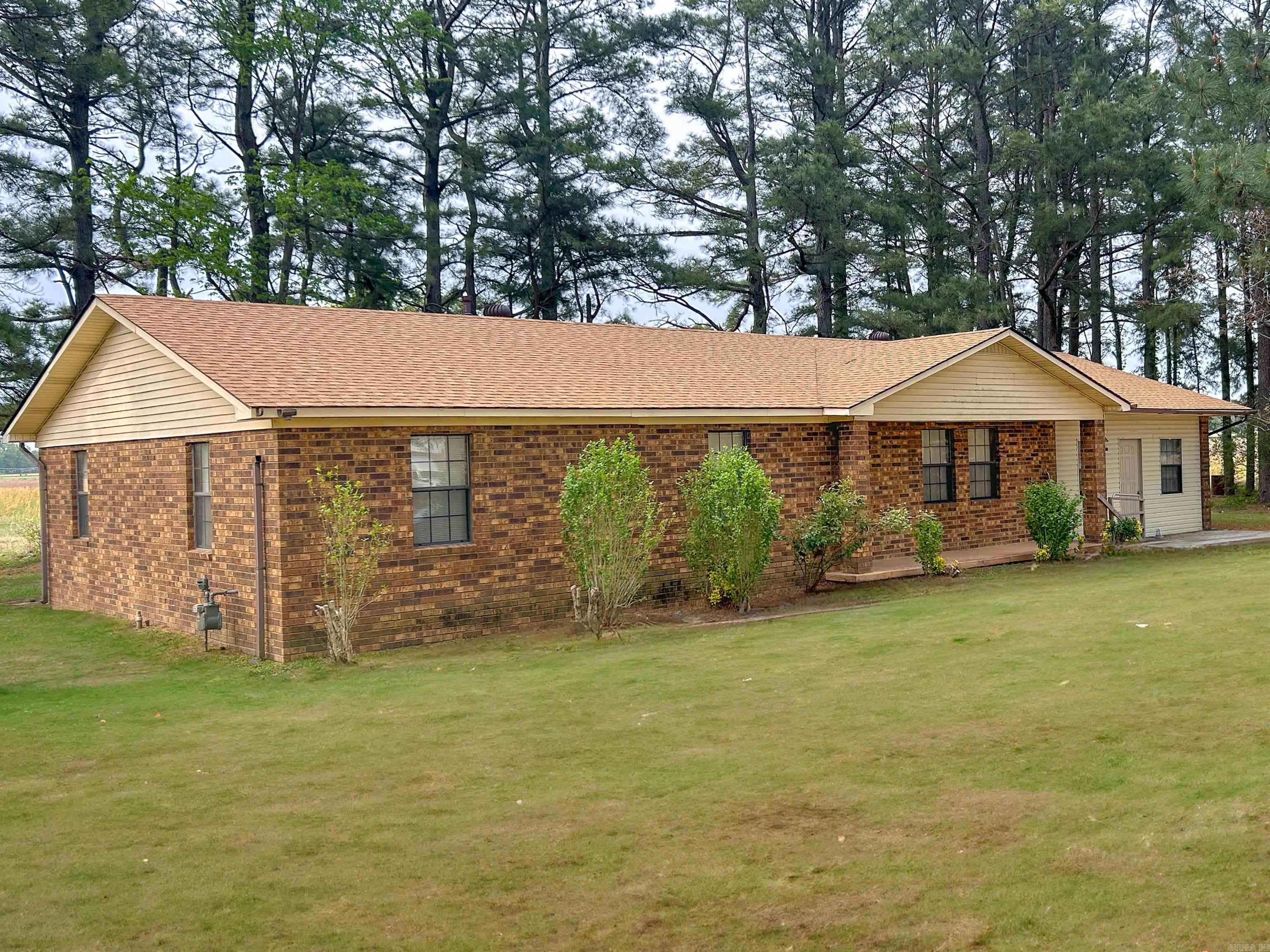 Experience country living at its finest in this original farmhouse! Built in 1989 this home offers 3 bedrooms, 2.5 bathrooms, a bonus room, shop, shed, and more. Unique opportunity to get the best of both worlds, and let me tell you why! This home sits just outside the city limits, but just off the main highway on 20 acres M/L. So while you're not right in the middle of the city life, you're still conveniently close to town. Fence the property in for cattle or horses, farm it, or fish out of your very own pond right in your backyard! This is a package deal meaning it also comes with a guest home, which is also 3 bed 2 bath. Both have some handicap accessible features throughout. Both homes and the shop had a new roof put on in 2022/2023. Very well built home that is ready for you to come in and make customizations to fit your style! Contact the listing agent to inquire further.
