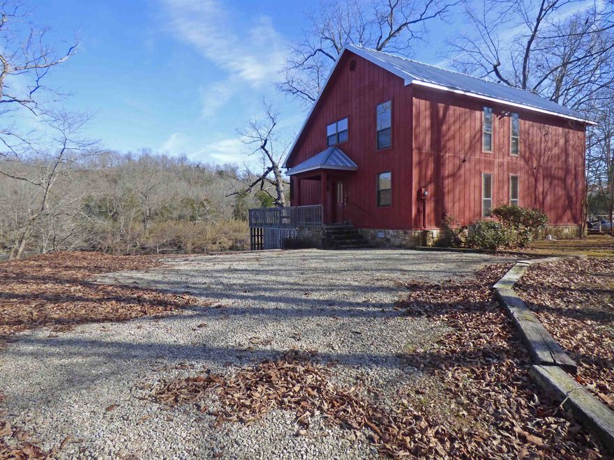 Rustic Wood Cabin inside; this beautiful home has 4 bedrooms, 2 & 1/2 baths, utility room, gas log fireplace, living room and kitchen. Screened-in porch perfect for taking quiet naps while the Spring River rolls along below. There's also a large back deck that overlooks the gorgeous Spring River and surrounding area. All this is sitting on 2.3 +/- acres providing enough room for a your shop/garage. The cabin comes furnished with all the appliances and most of the furnishings so you can move right in and enjoy the "River Life" with some of the best trout fishing you will find. Or just get in a canoe, raft, or kayak and float down the great Spring River.