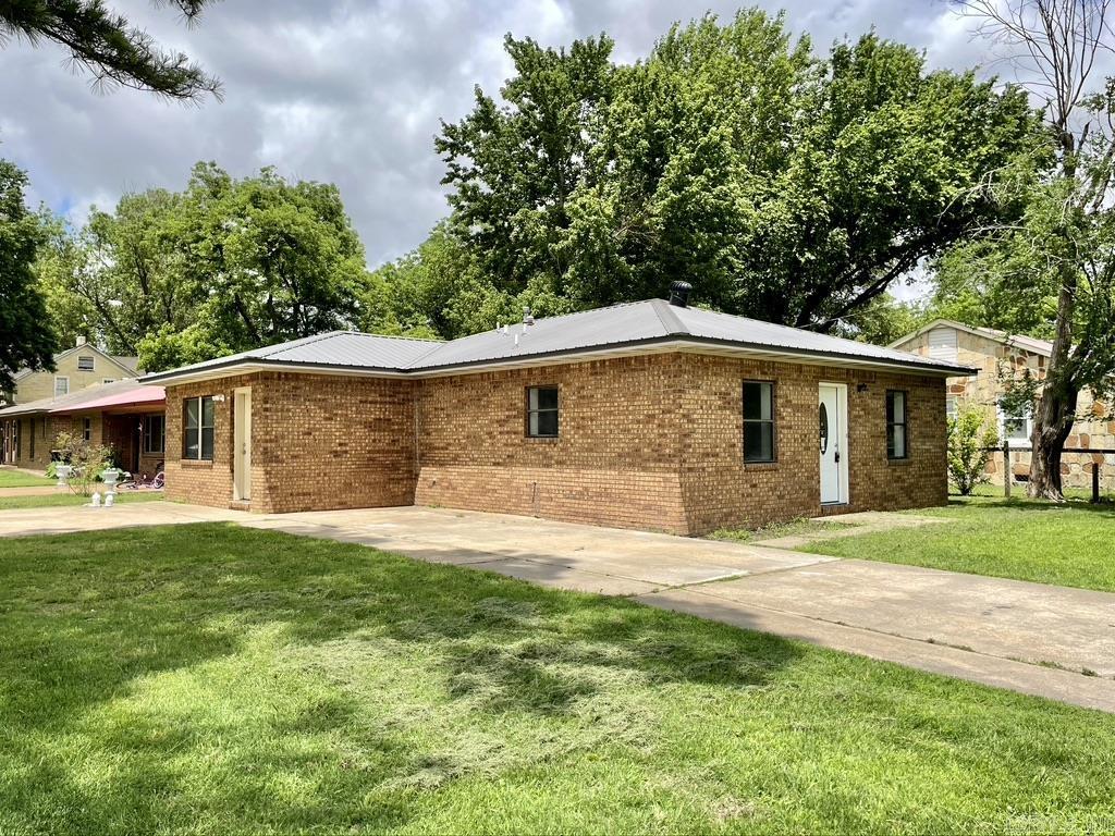 Welcome to 202 Hazel Street in Walnut Ridge, Arkansas! This beautifully remodeled brick house blends classic charm with modern elegance. Featuring a durable metal roof and slab foundation, it requires low maintenance. Located in the heart of Walnut Ridge, you're minutes from local stores, schools, and parks. Inside, you'll find a thoughtfully designed floor plan with spacious living areas and abundant natural light. The neutral color palette and modern fixtures create a warm atmosphere. The fully renovated kitchen is the heart of the home, boasting gorgeous light wood butcher-block countertops, stainless steel appliances, and ample cabinetryāideal for meals and entertaining. Each cozy bedroom offers plenty of closet space, ensuring comfort for everyone. Stylish bathrooms feature elegant tile work and contemporary granite vanities. The low-maintenance yard is perfect for relaxation or hosting guests, with the large extra driveway doubling as patio space for outdoor dining and socializing. Donāt miss the chance to make this stunning remodeled brick house your new homeāschedule a viewing today!