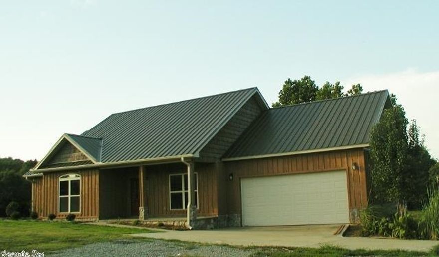 Super ranch style home sitting on 4 acres.  Unique concrete floors, new carpeting in bedrooms, oversized walk in shower in master bath, fresh paint throughout, newly landscaped,  stained kitchen cabinetry with tile counter tops, bay window in breakfast area and large living room overlooking backyard deck.