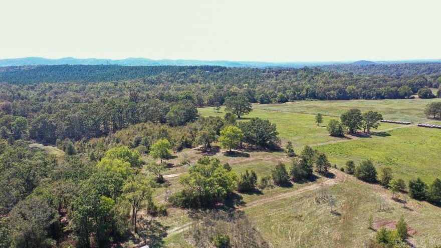Nestled in the breathtaking Ouachita Mountains, this 60.90+/- acre tract offers the perfect blend of natural beauty, privacy, and usability. The property features a mix of partially cleared land and towering mature timber, creating an ideal setting for recreation, a homesite, or a private retreat. Access is being enhanced with a newly surveyed 40-foot road frontage from Stoney Point Road, ensuring convenient entry while maintaining seclusion. Along the entire eastern boundary, year-round Bolen Creek provides a serene water feature perfect for relaxing, exploring, or even discovering your own private swimming hole. A pond on the property offers additional enjoyment, whether for fishing or simply unwinding during the evenings. Located less than one mile from the Ouachita National Forest, you’ll have immediate access to thousands of acres of public land for hiking, hunting, and outdoor adventure. Whether you’re looking to build your dream home, create a weekend getaway, or embrace a more self-sufficient lifestyle, this property delivers. With fertile ground, fresh water sources, and level areas suitable for gardening or homesteading, the possibilities are truly endless. SEE DOCUMENTS