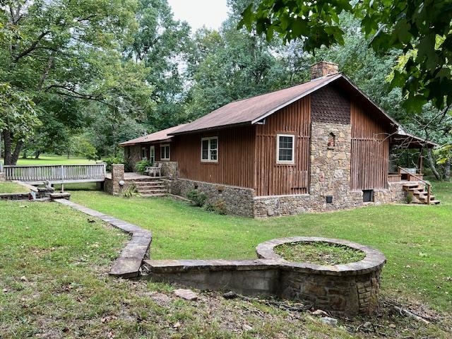 Step into a hunter’s haven and homesteader’s paradise with this Rustic 1,917 sqft retreat on 20 acres in Mountain View. Built in 1996, the highlight of this home is the expansive family room, featuring vaulted ceilings perfect for showcasing your trophies or enjoying downtime with family and friends. For the hunters, it includes a built-in gun rack cabinet and a bar—ideal for post-adventure gatherings. For the homesteader, the versatile acreage offers endless possibilities. Enjoy the stone outdoor cooking fireplace kitchen with waterfall, a deck for an above-ground pool, a large pond with a pier, and a spacious workshop for all your projects and equipment. For women seeking a retreat within the retreat, the large main bathroom is an escape in and of itself, featuring a luxurious soaking tub and a custom walk-in shower. A creek across the road enhances the natural beauty. There is so much to see and take in on this vast property, that you have to view in person. Come experience peace, privacy, and abundant wildlife (deer and turkey)—this is your chance to create the lifestyle you’ve always dreamed of in the Ozark Mountains!