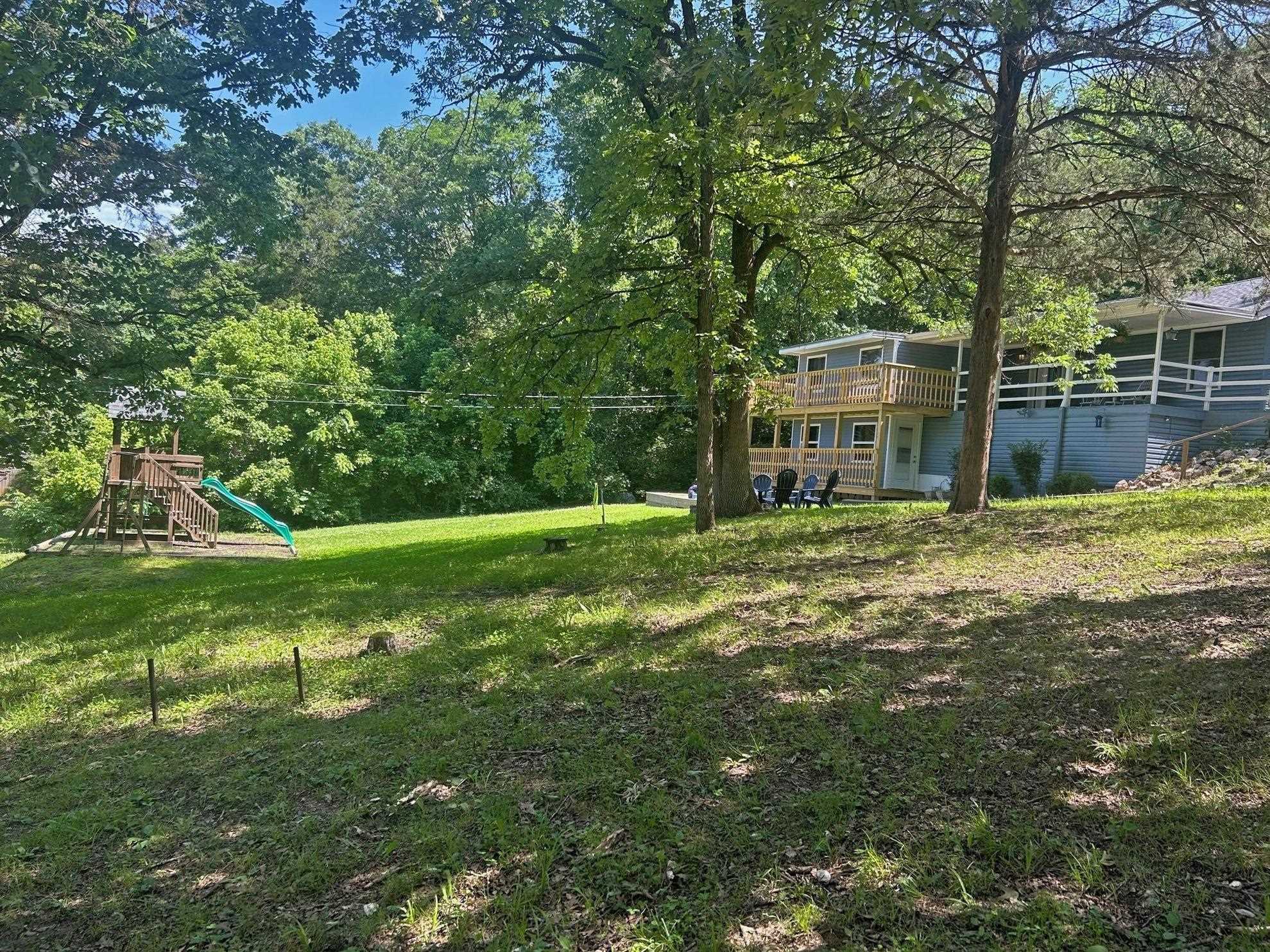South Fork of the Spring River Property - This house has over 3,200 square feet of living space on 2 levels. Offers 6 bedrooms & 3 baths. Main level has living room with a gas log fireplace, kitchen with stainless steel appliances, utility room, Laminate wood flooring, vinyl windows, 2 baths & 4 bedrooms. The lower level has a family room, 2 bedrooms, bath, and plenty of storage space. House sits on 2 lots for over a half acre of land.