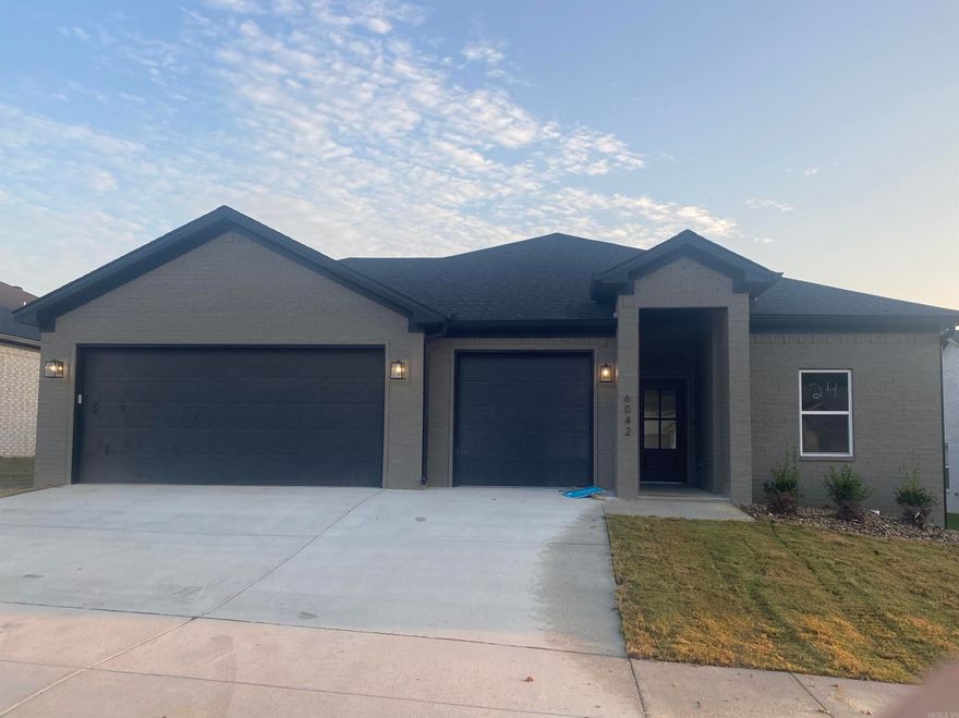 All Brick 1 level home with 3 bedrooms, 2 bathrooms with a 3 car garage. Open floor plan, large windows for natural lighting.  Custom tile shower in primary bathroom, hard surface countertops.
