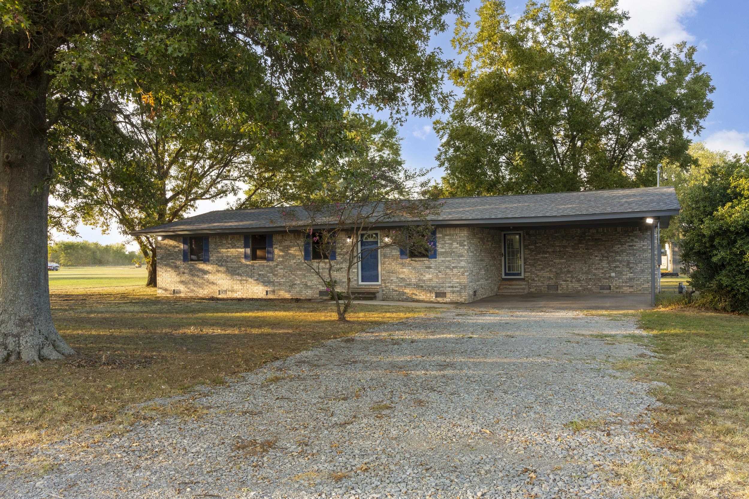 Completely remodeled 3 bedrooms, 2 full bathrooms, 1554 sq ft modern ranch, situated on 3.77 acres. Roof, electrical, plumbing and septic tank updated within the past 4 years. Refrigerator stays! Two oversized shops measuring 90x47 feet, a 34x24 feet & a 10x10 storage building. Property provides small farming potential only 8 minutes away Interstate 440. Come check it out! MOTIVATED SELLER!