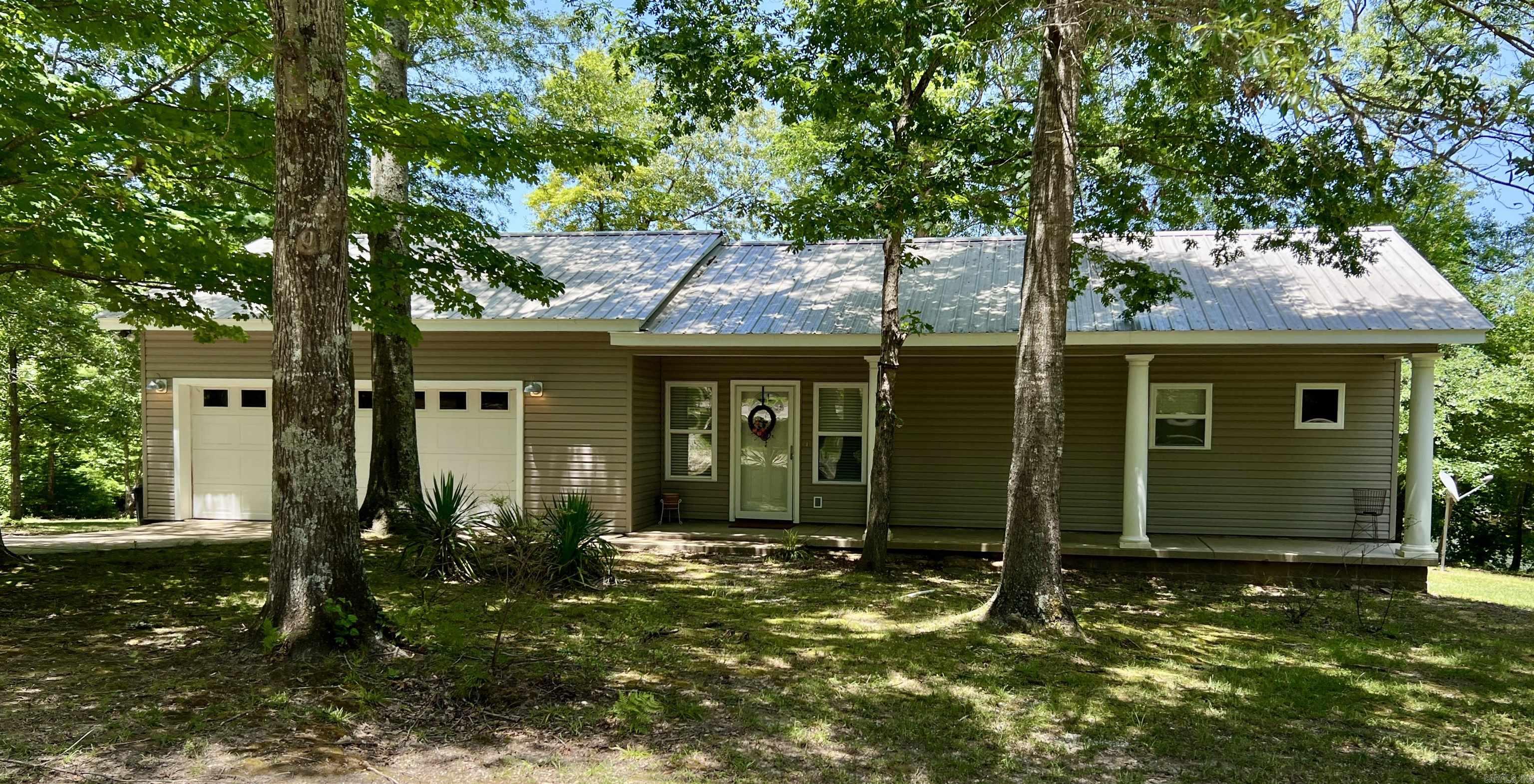 Nestled just minutes from both Henderson State University and Ouachita Baptist University, this 10-acre property offers a perfect blend of convenience and natural serenity. The well-kept 1-bedroom, 1-bathroom home sits on a gentle rise overlooking a beautiful 3-acre stocked pondāideal for peaceful mornings or relaxing evenings on the back deck. Designed with an open floor plan, the home feels spacious and inviting, with scenic views that bring the outdoors in. A portion of the garage has been thoughtfully converted into a large storage room, providing extra functionality without sacrificing space.