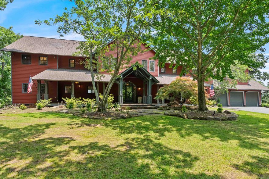 Experience country living at its finest in this rare home in the gated Ridgefield Estates neighborhood nestled on 5 private acres. The main home offers just under 4,500 SF with countless improvements and incredibly curated outdoor living spaces.  The welcoming front porch and custom front door open to a two-story great room with beautiful custom built-ins and rich natural wood accents with stunning Pinnacle Mountain views. The open-concept kitchen was recently remodeled with KitchenAid appliances and opens to the dining room. The main-level primary bedroom suite features a renovated bath and walk-in closet. Upstairs offers 3 bedrooms, 2 baths, a game room with wet bar, and a soundproof media room with 4K projection. Enjoy the outdoors from the screened-in porch or back deck while watching deer and wild turkeys roam. The main home offers an attached 3-car attached garage and mosquito misting system. A detached shop offers 6 garage bays and a climate-controlled shop on the main level, perfect for indoor pickleball. The shop also includes a framed 1,700 SF efficiency apartment with rough-in electrical, mechanical, and plumbing—ready for completion. Whole home generator provided!