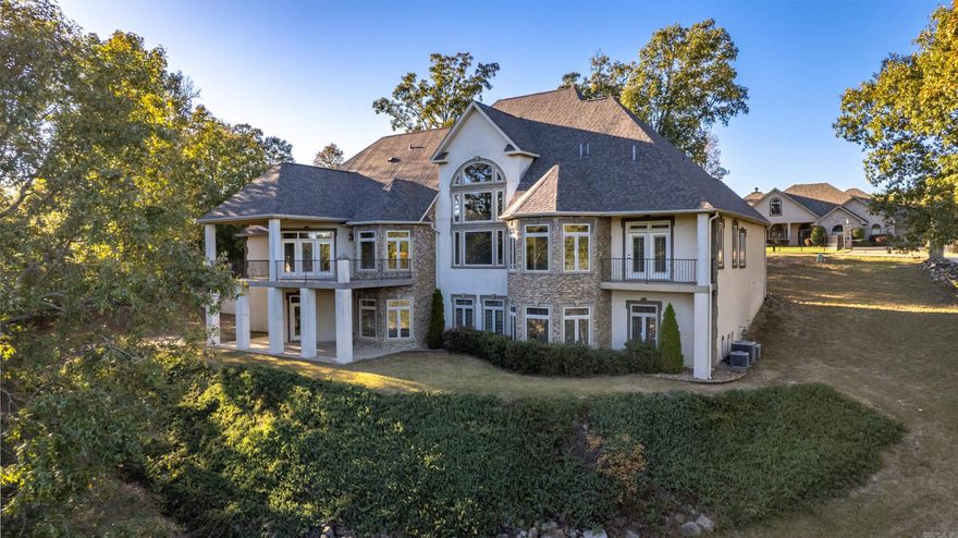 Exquisite Hilltop home on the prestigious Cougar Terrace! Built in 2008, this 5 Bedroom, 5.5 Bathrooms, two story with a fully finished basement. The main level of the home has an open floor plan that flows from grand foyer, living, dining and kitchen with views through the large windows is amazing. The main level Master Suite, laundry, 2.5 baths, and large garage. Upper level features 2 bedrooms, 1bathroom, family room and a second laundry room. The finished basement features 1 bedroom, 2 bathrooms, office, wine cellar, an office, and an area for a second kitchen. This home is perfect for a family and entertaining!