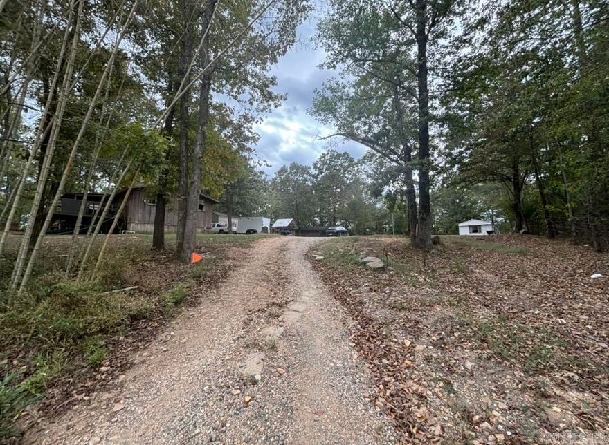 Check out this incredible opportunity located outside Hot Springs in the Magnet Cove School area! This secluded property is 1.55-acres featuring THREE dwellings and two are currently leased! This is a fantastic chance for a great return on your investment.   Double wide 1344 sq ft, 3 Bed, 2 bath  Cottage 504 sq ft, 1 bed, 1 bath  Single wide 1200 sq ft, 3 bed, 2 bath.