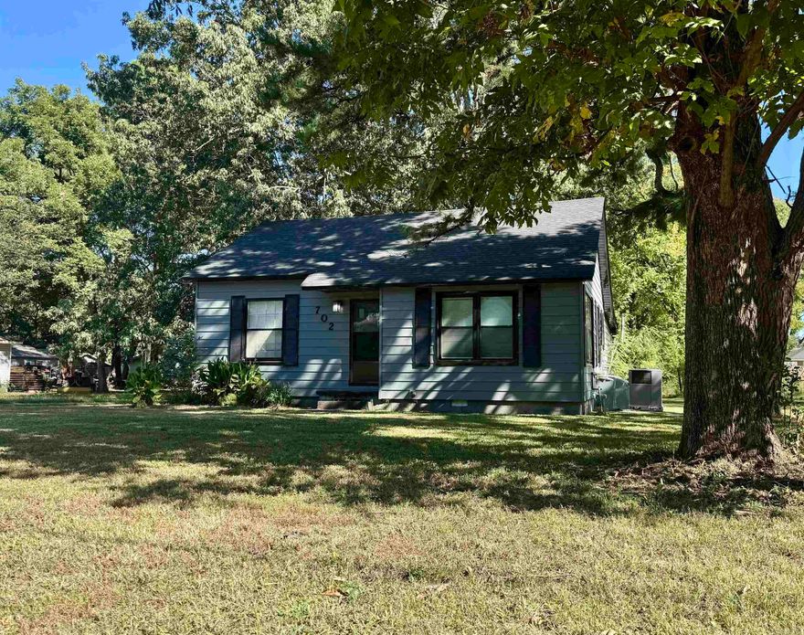 Check out this cute 2 bedroom 1 bath bungalow with a covered porch and a shop! The kitchen has newer white cabinets, granite countertops, and a stainless microwave & refrigerator! There is a spacious living room and a formal dining room with hardwood flooring. The bedrooms are big & the laundry room has room for an office or sewing area.  You will love the large shop and the 1/4 acre shaded lot with pecan tree. Walking distance to Native Brewery.  Home has 2 gas wall hung heaters as a backup heat source and a large laundry/mud room. Sold AS IS