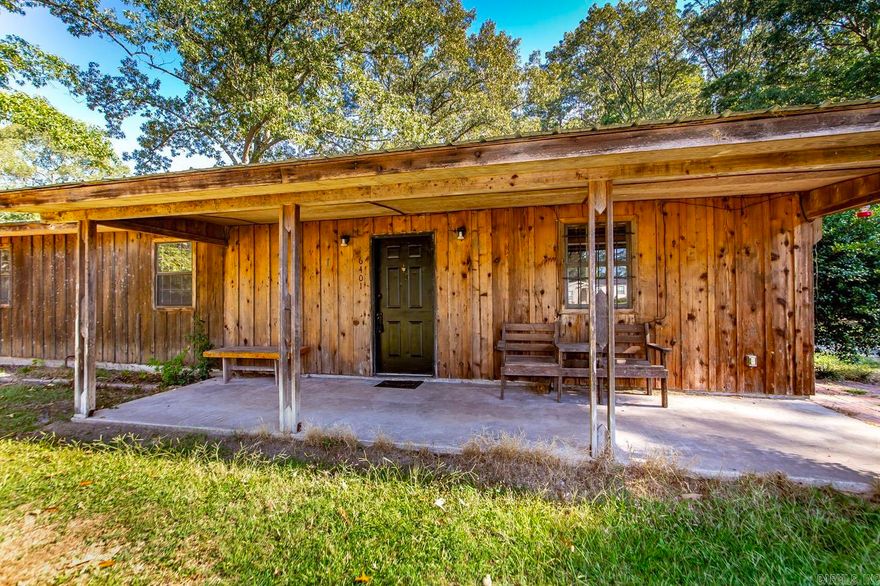 Set on 3 acres in White Hall, this property offers space, privacy, and versatility. The rustic wood-sided home features spacious living areas, new tile flooring throughout, and flexible rooms filled with natural light. A large shop with its own office adds valuable functionality for storage, projects, or work space. Mature trees and open yard areas create a peaceful setting with plenty of room for outdoor activities, gardening, or future expansion. Conveniently located near town and schools, this property blends country charm with practical amenities. Schedule a showing to see the possibilities.
