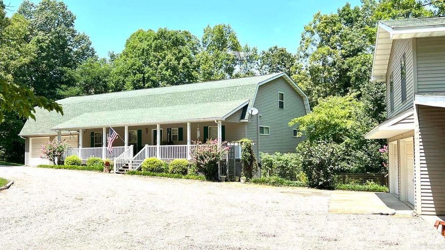 Beautiful Country Home on 5.6 acres minutes to Lake Norfork & Tracy Marina. Custom built 5,500 sq. ft. home features 5 bedrooms-4 baths. Energy-efficient 6" wall construction. 2017 Roof, Geo-Thermo Water Furnace H&A system serviced @ yr. supplies hot water to the water heater. Bonus 576 Sq.Ft. Apartment-one bed/onebath, heated & cooled, above the detached 2 car garage. Note: New paint on main floor & wallpaper removed, vinyl laminate flooring on main level & a new handicap tub/shower. Well maintained and located on a quiet paved dead-end road. It will make a great family home or lodge with plenty of room on every floor. Enjoy the outdoors on the home's 1600 sq. ft of covered porches & decks. Upstairs is a family room, oversized sleeping area, a large bedroom, 100 ft. of storage closets & full bath. Full walkout basement has a large game room, den, oversized bedroom & full bathroom. Utility/plumbing room for easy access to H/A &plumbing. Call listing agent for more information.