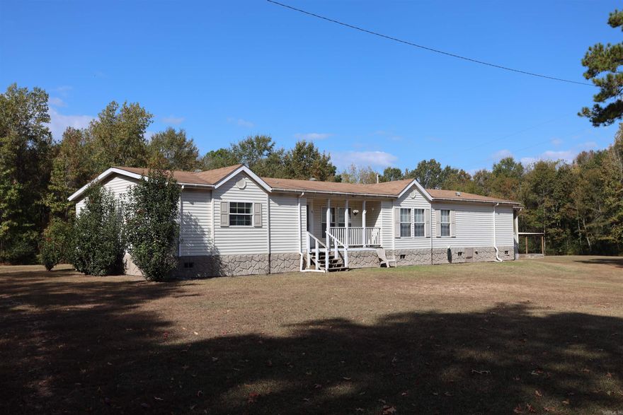 This 3 bedroom 2 Bath mobile home sits on approximately 5 acres.  Approximately 3 acres of woods.