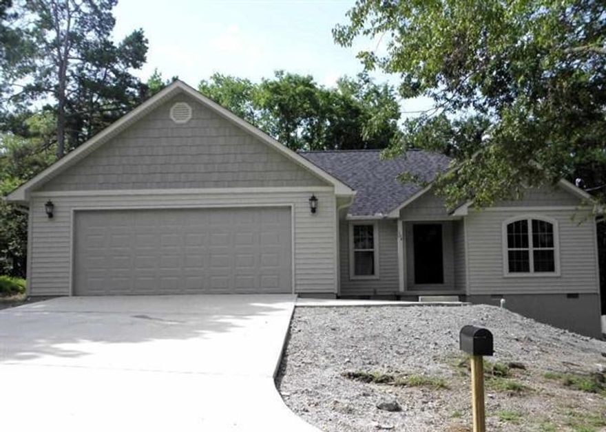 Great 3/2 new construction in an established neighborhood. Bright and open with high ceilings and crown molding. Handsome dark wood floors and FP in LR that opens onto a covered wood deck overlooking back yard. Nice home office w/built in deck and upper cabinets. Spacious galley eat in kitchen w/ tile flooring, granite counters and stainless appliances. Large laundry room with storage. Fantastic master suite with h/h closets, jetted tub & w/in shower. Stylish fixtures throughout. Two car garage.