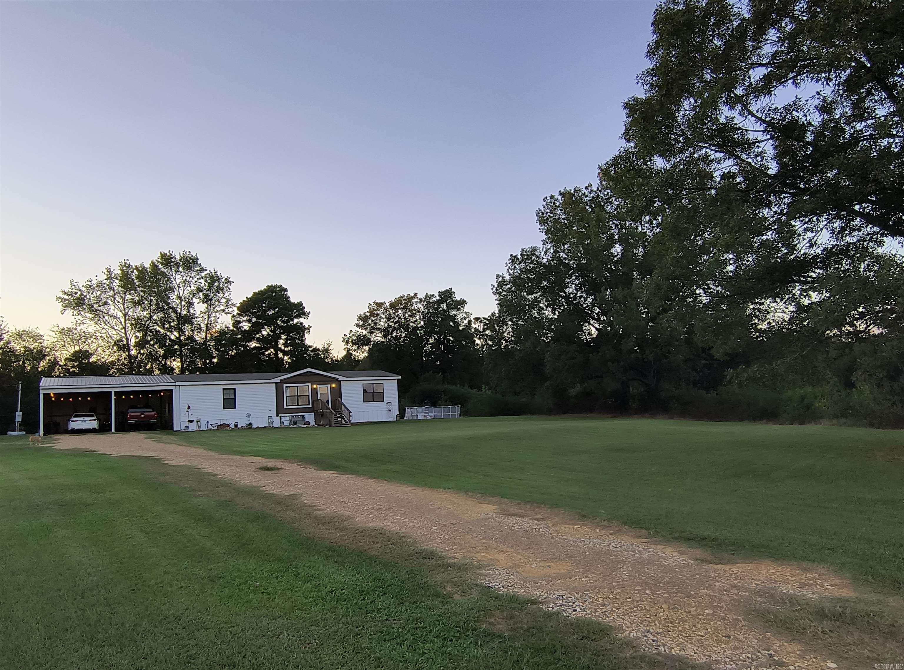 Enjoy peace and quiet rural living with this beautiful 24-acre property located just outside Prescott. House sits off highway, very private. The land features mostly open pasture with some woods toward the back and plenty of big deerāperfect for enjoying nature or exploring on foot or ATV. The pastures are productiveācurrently yielding approximately 29 rolls of hay twice a yearāmaking this an excellent property for hobby farming, livestock, or simply enjoying open land. Deck for barbecues and entertaining as well as a pond on the property.